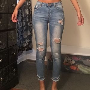 blue ripped and distressed jeans